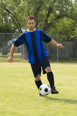 soccer - football player dribbling