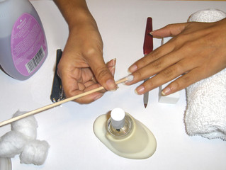 manicure-using orange wood stick