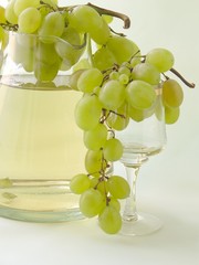 jugful of wine and grapes