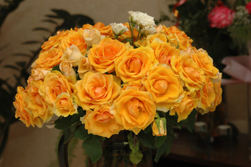 vase orange and yellow roses