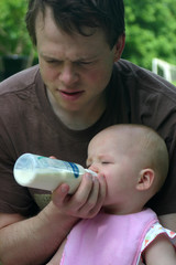 father feeding his baby