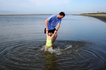 father playing with daughter