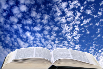 clouds in the sky and open book
