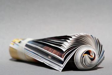 isolated rolled magazine,