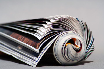 isolated rolled magazine, close up