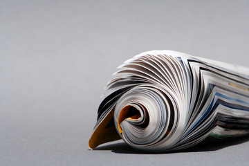 isolated rolled magazine,