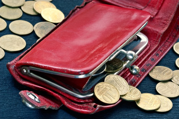 shabby purse with coins