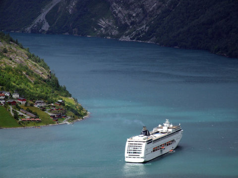 luxury cruise ship in a fjord