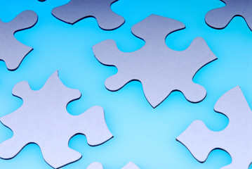 puzzle pieces on light blue