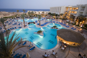 hotel pool at dusk on
