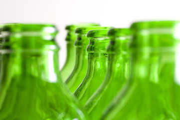 a group of green beer bottles