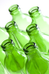 a group of green beer bottles