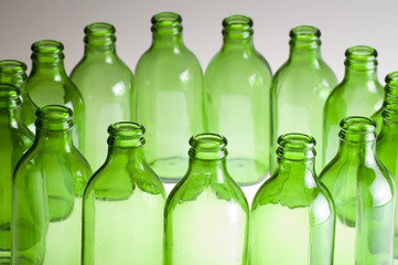 a group of green beer bottles