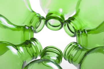 a group of green beer bottles