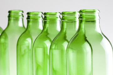 a group of green beer bottles