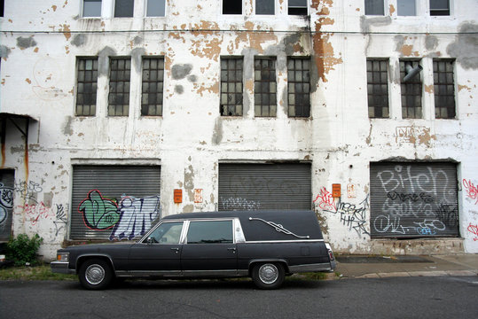 hearse and old warehouse