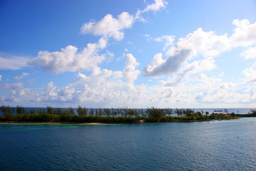 white clouds over deep blue caribbean water