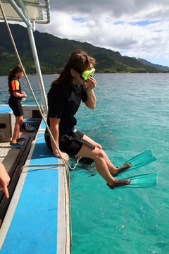 Woman Jumping Off A Boat