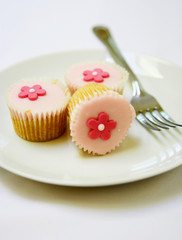three pink mini cupcakes
