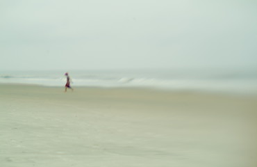 foggy beach with young boy