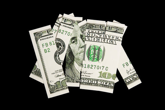 100 dollar bill in pieces