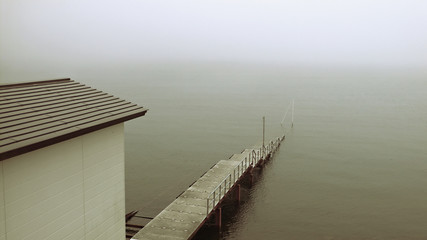 old pier in deep mist