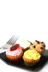 Cupcakes on black plate