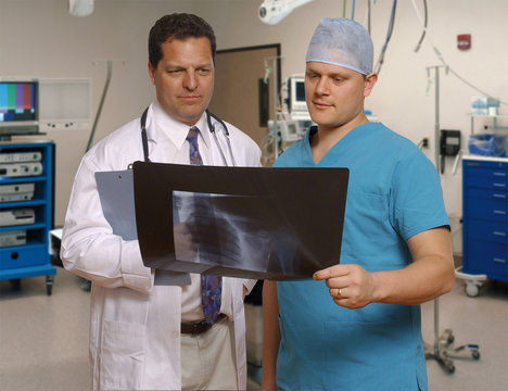 doctor and surgeon reviewing x-ray