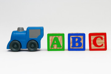 Toy train and toy alphabet blocks