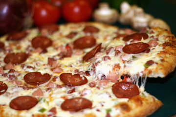 pepperoni pizza with slice