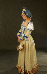 Fototapeta na wymiar girl in polish clothes of 16 century with mirror-fan