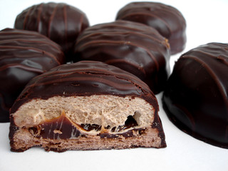 six chocolate brownies on a white background