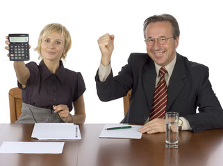 business meeting - woman displays calculator