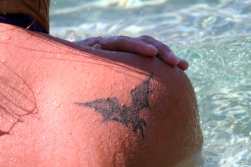 bat tattoo on the shoulder