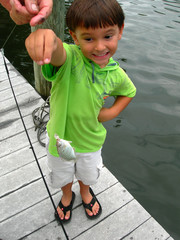 boy catching first fish - 1268760