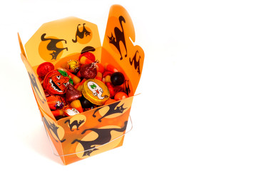 halloween candy in orange chinese container