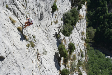 tanned woman abseiling