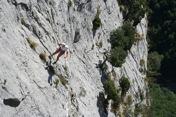 tanned woman abseiling