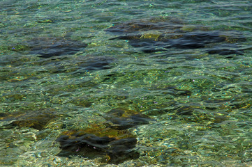 pure sea water and a rock