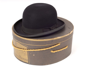 old derby hat resting on hatbox
