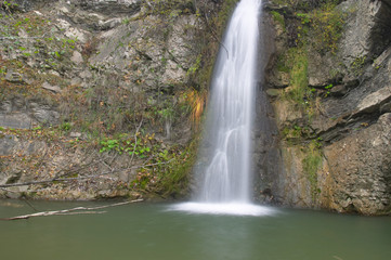 Fototapeta na wymiar brook waterfall and rocks