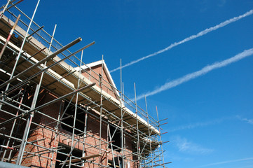 scafold, sky and new house