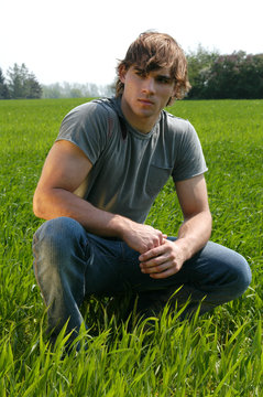 young man at the green grass