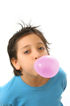 Boy Blowing A Pink Bubble Gum