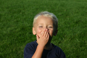 boy blowing a kiss
