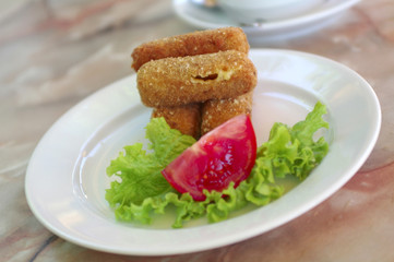 fry-cheese appetizer with lettuce and tomato