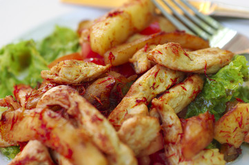 hot chicken salad with lettuce, apples and tomatoe