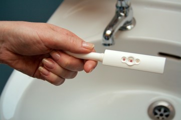 pregnancy test by sink: positive