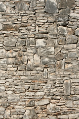 old, grey weathered stone wall