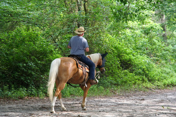 man horseback riding